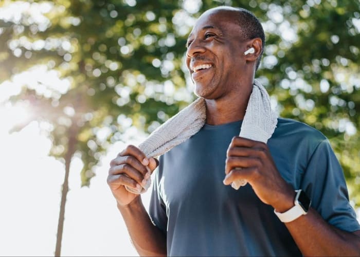man running outside to prioritize self care